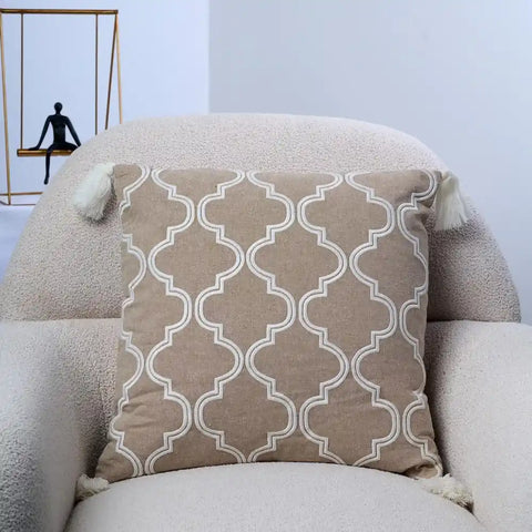 Beige Throw Pillow with White Moroccan Clover Pattern and Tassels