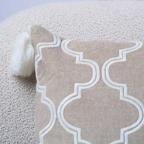Beige Throw Pillow with White Moroccan Clover Pattern and Tassels