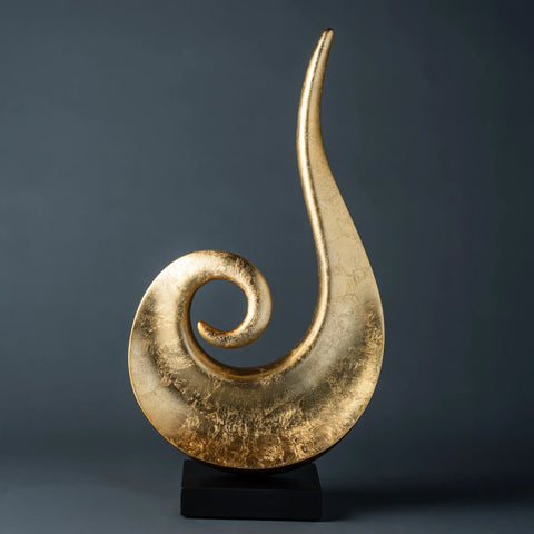 Modern abstract gold spiral sculpture