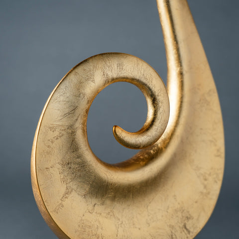 Modern abstract gold spiral sculpture