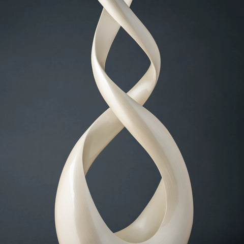 white Deco 79 Polystone Abstract Swirl Sculpture with a black base