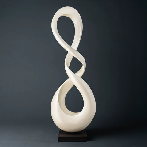 white Deco 79 Polystone Abstract Swirl Sculpture with a black base