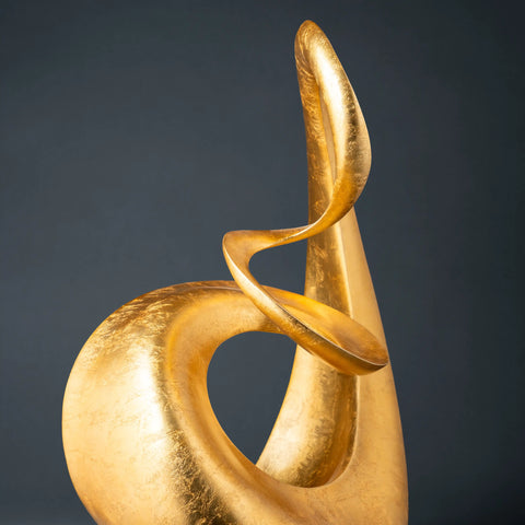 Deco 79 Aluminum Abstract Swirl Sculpture in gold.