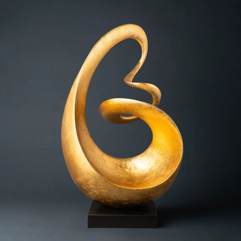 Deco 79 Aluminum Abstract Swirl Sculpture in gold.